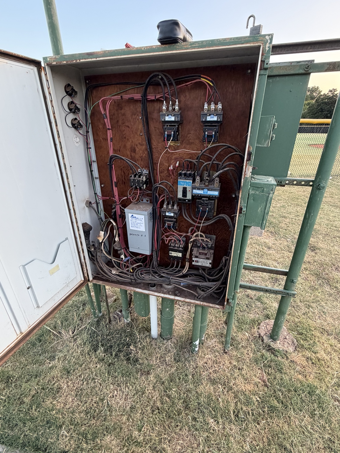 Aged electrical control panel opened for troubleshooting
