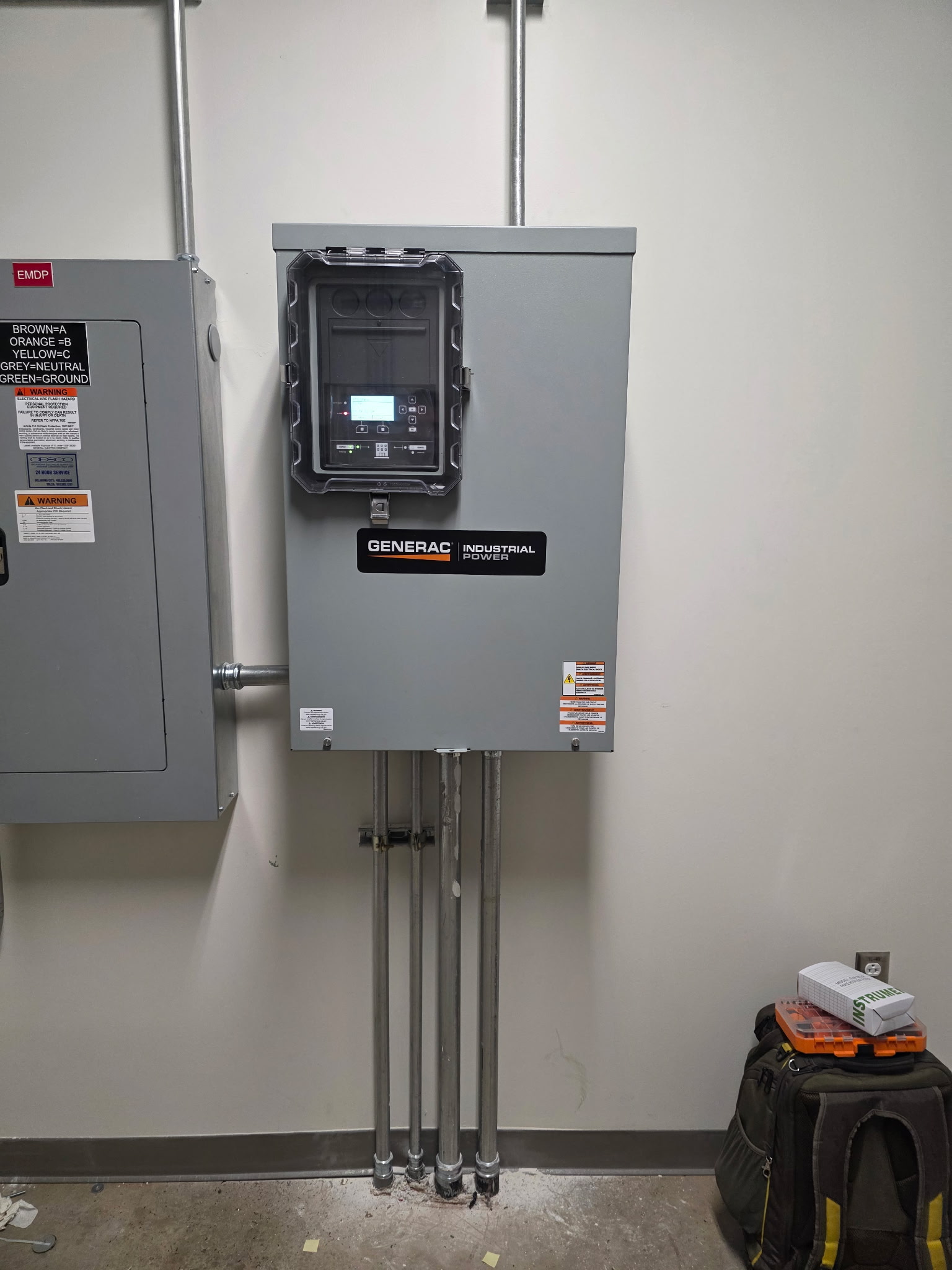 Generac industrial transfer switch installed on commercial wall